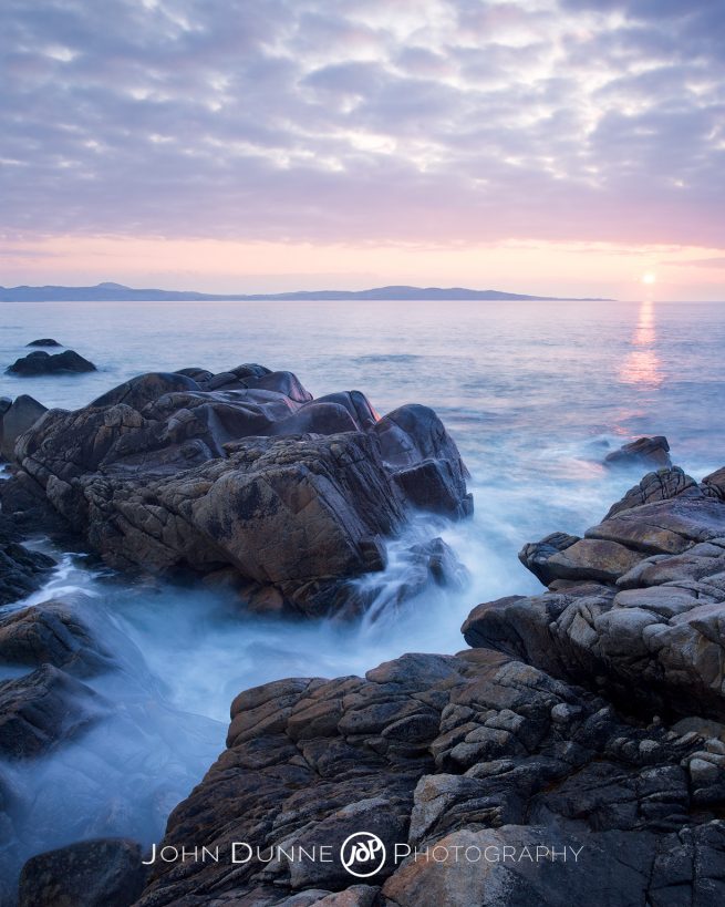 Sunset at Dunaff Bay by John Dunne. 