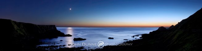 The Moon rises on an Antrim Coast by John Dunne. 