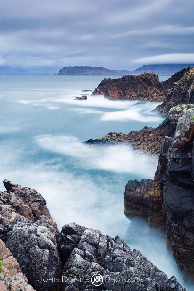 Waves Crash Upon the Bluffs by John Dunne. 