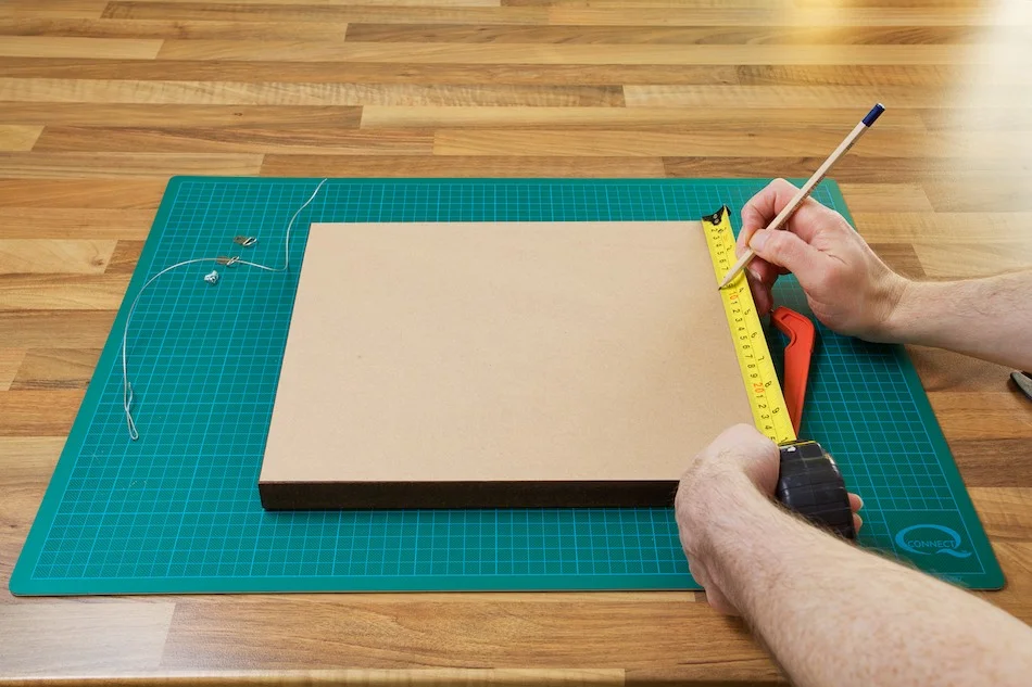 An image showing me measuring the location for the D-Rings from John Dunne Photography by John Dunne.